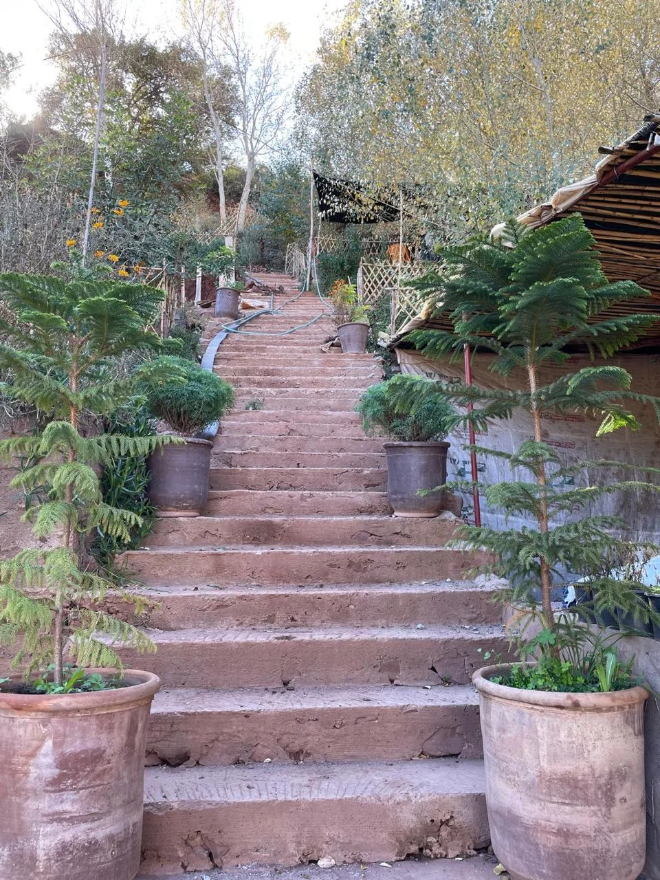 Entrance to a local garden where visitors enjoy lunch in Tighedouine